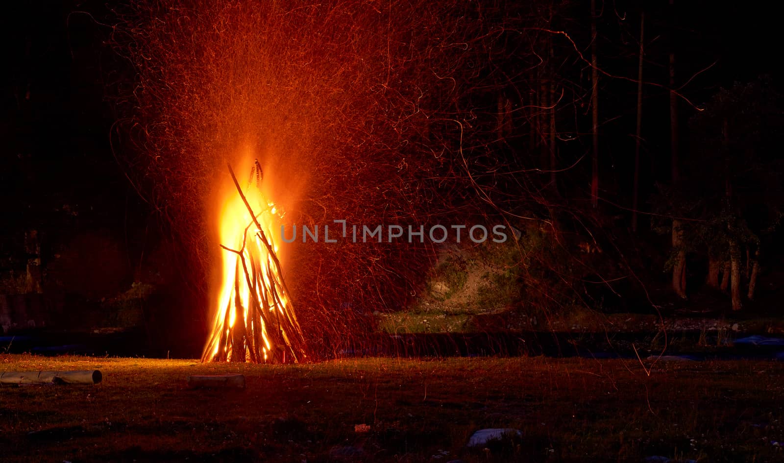 Big camp fire at night.