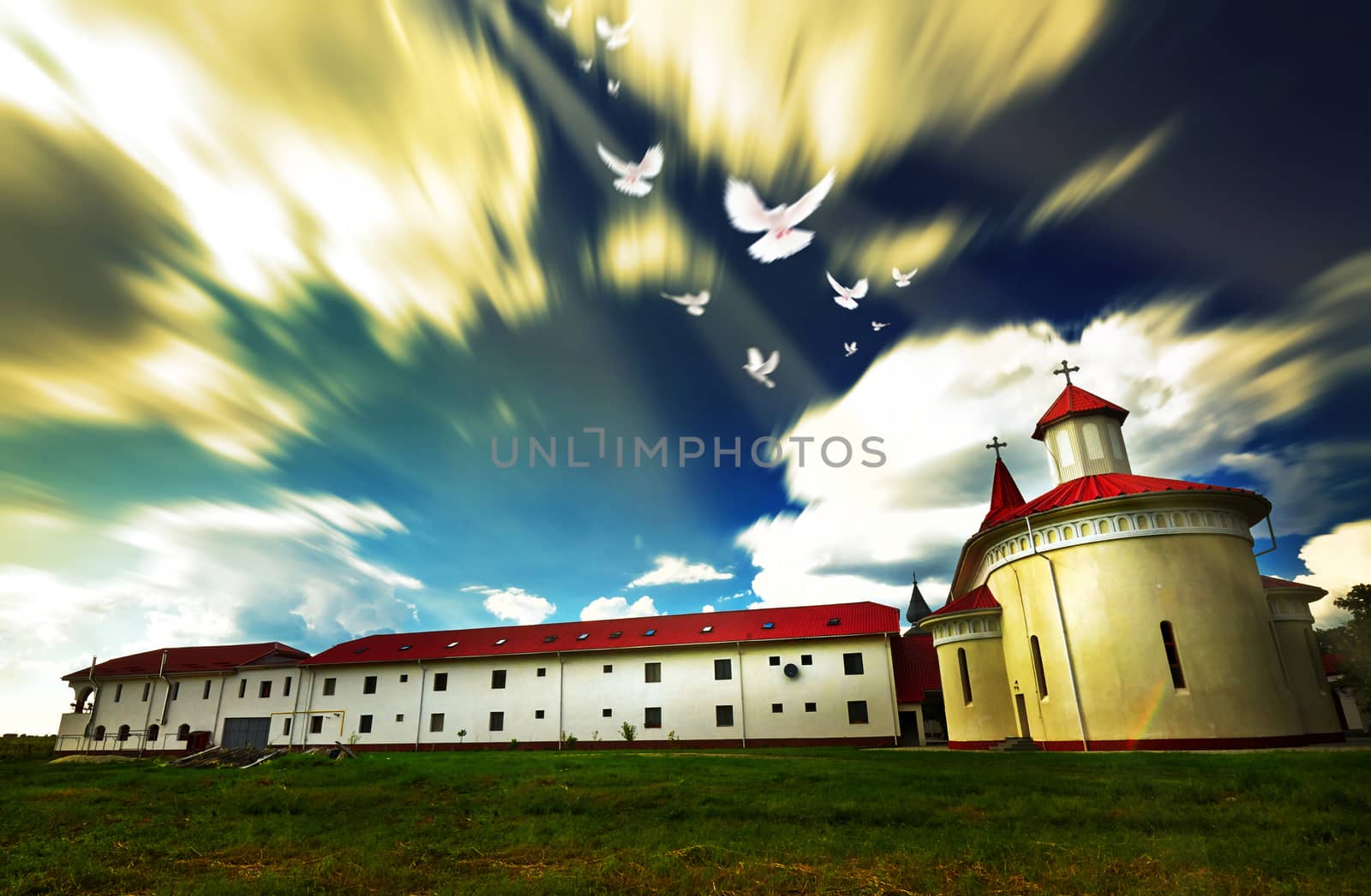 White doves over Sag Monastery in Timis, Romania.