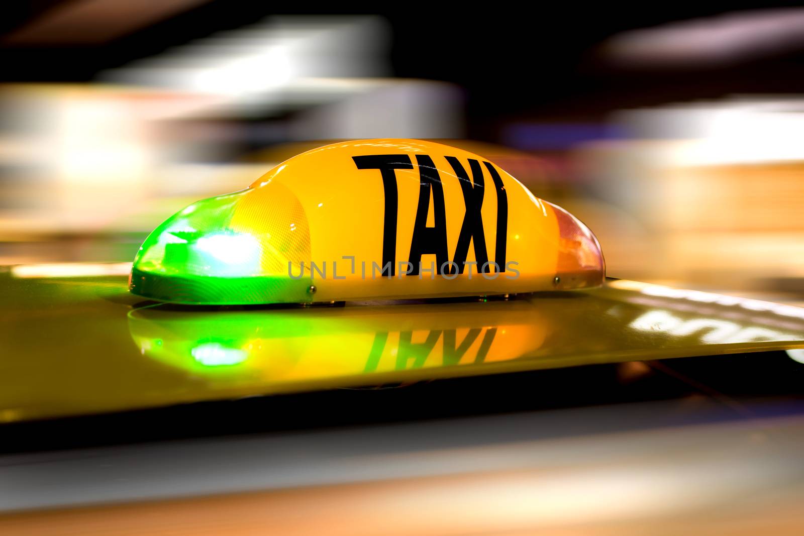 Taxi in motion with speed like blured background.