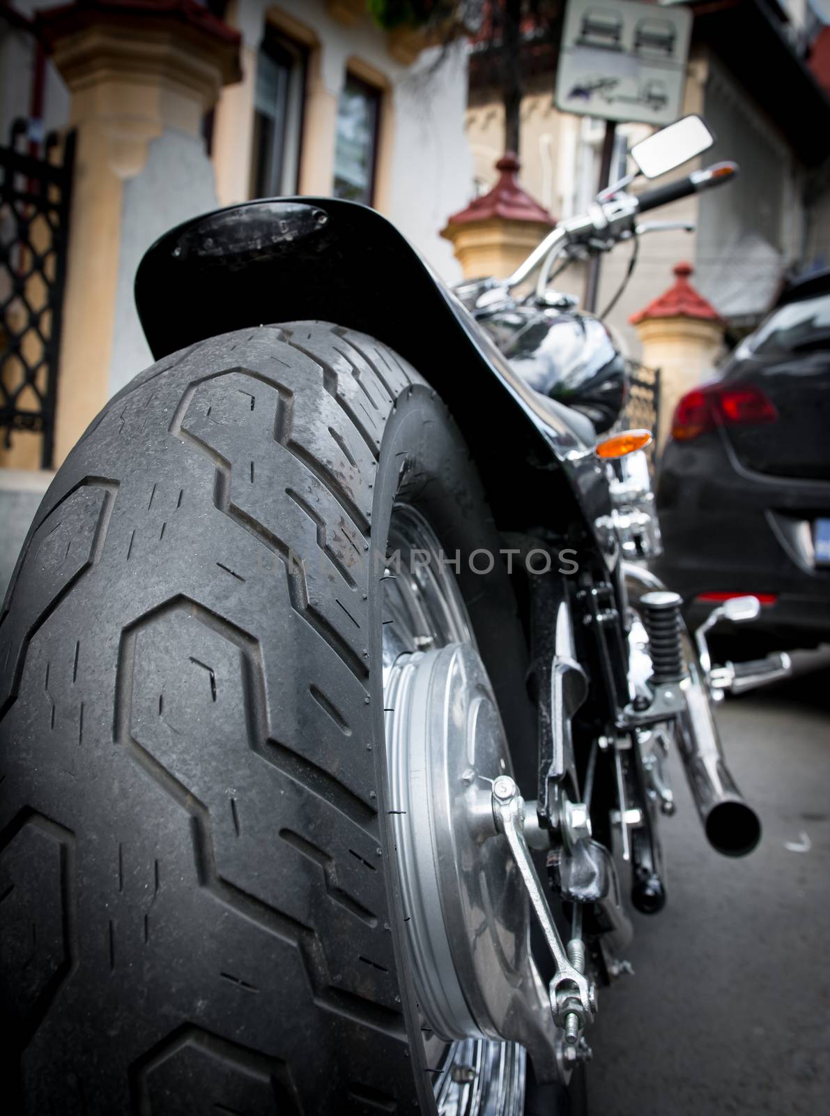 Big motorbike wheel with new tire.