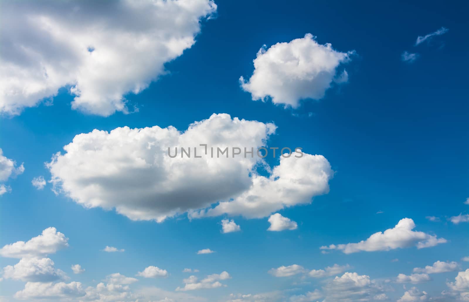 Blue sky with white clouds on sunny day background.