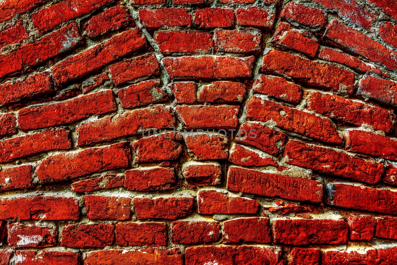 Vivid red brick wall texture.