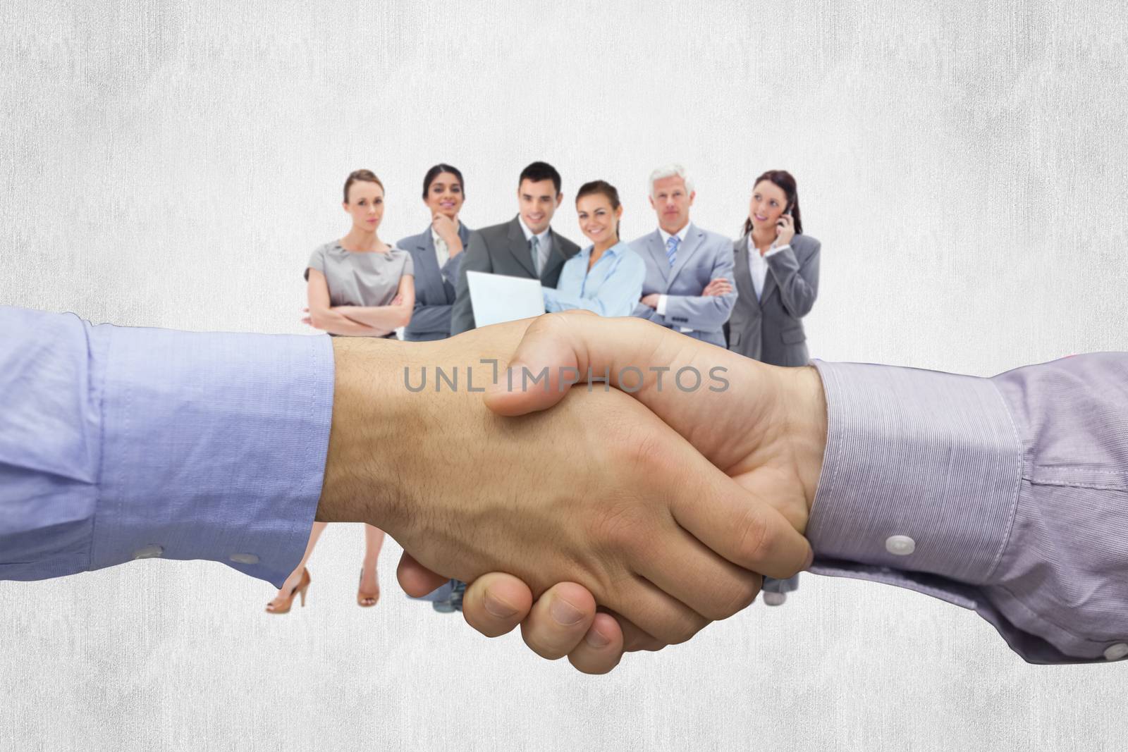 Hand shake in front of wires against white background