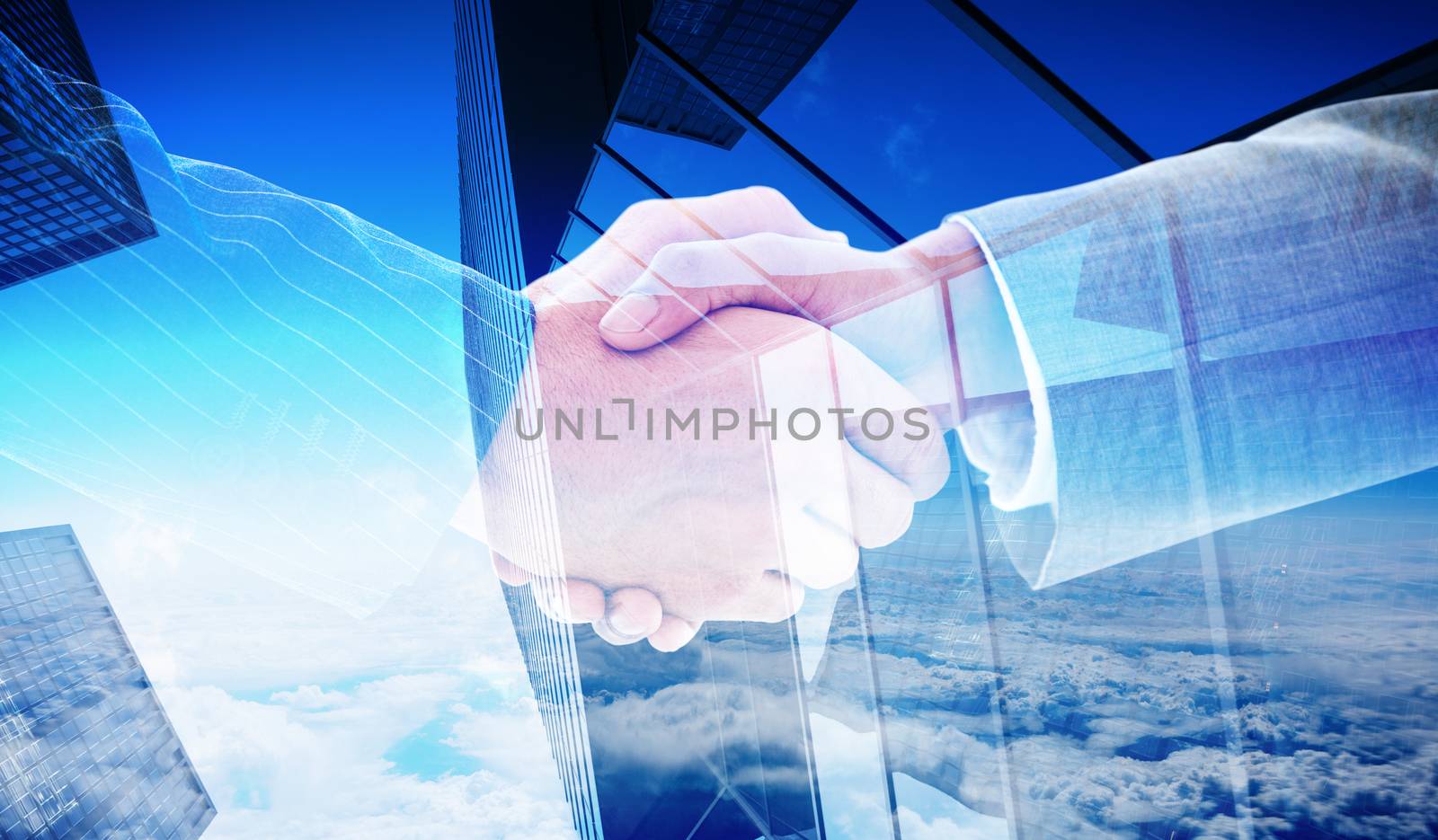 Business people shaking hands against skyscraper