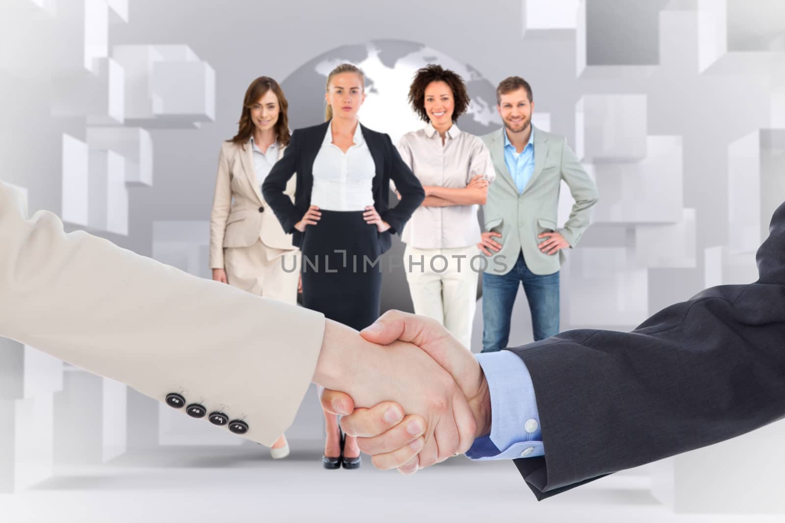 Smiling business people shaking hands while looking at the camera against planet on grey background with cubes