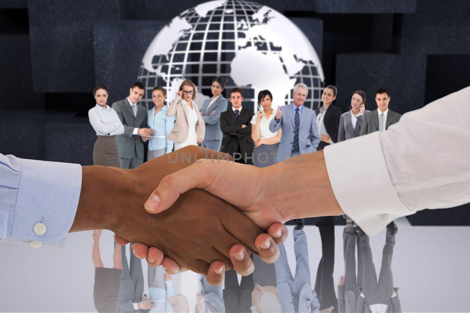 Composite image of close-up shot of a handshake in office by Wavebreakmedia
