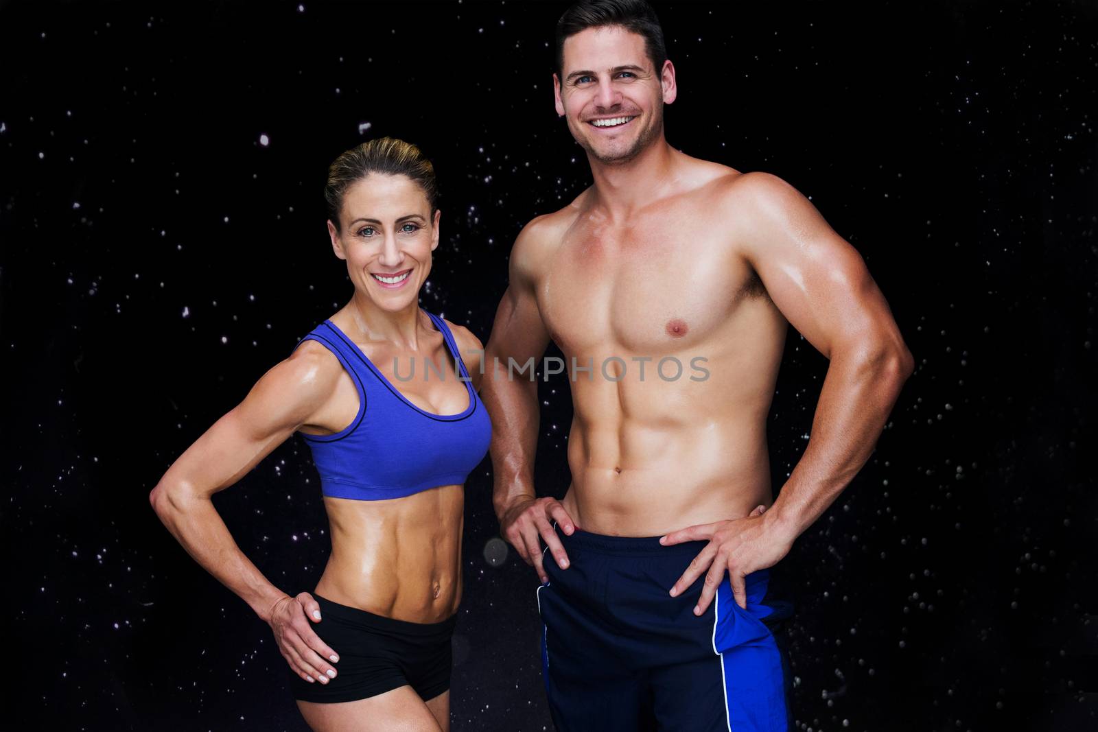 Bodybuilding couple against black background