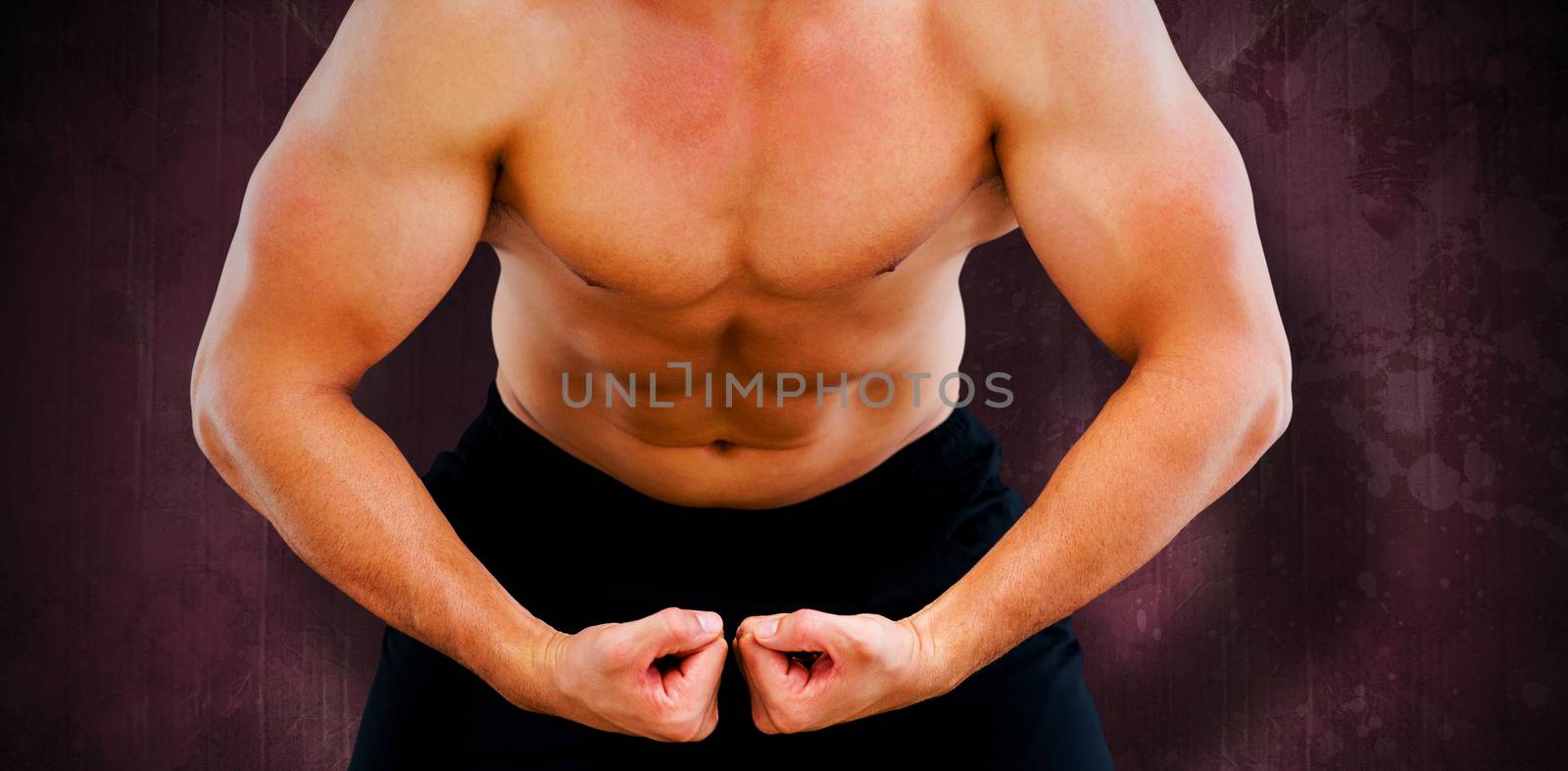 Bodybuilder flexing against red paint splashed surface