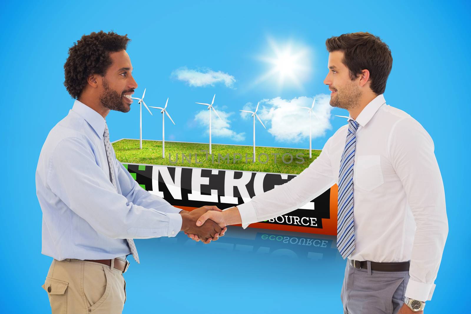 Smiling young businessmen shaking hands in office against wind turbine field in an energy saving battery