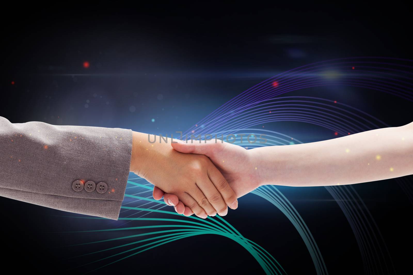 Composite image of handshake between two women by Wavebreakmedia