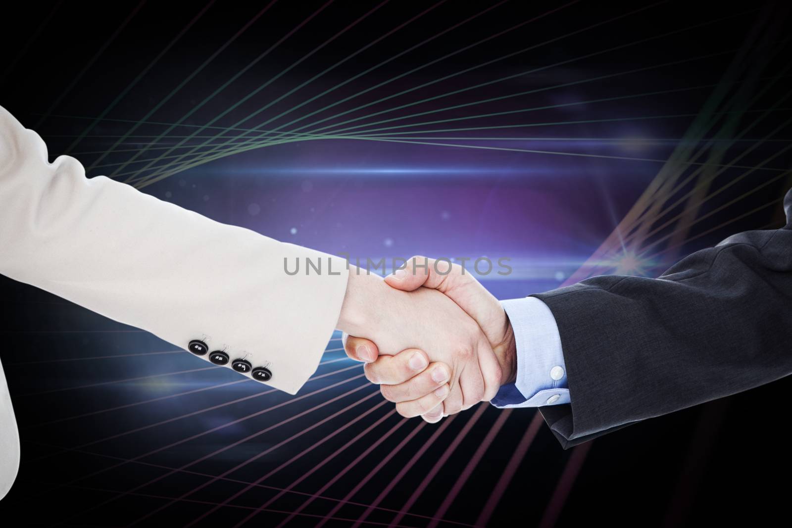 Composite image of smiling business people shaking hands while looking at the camera by Wavebreakmedia