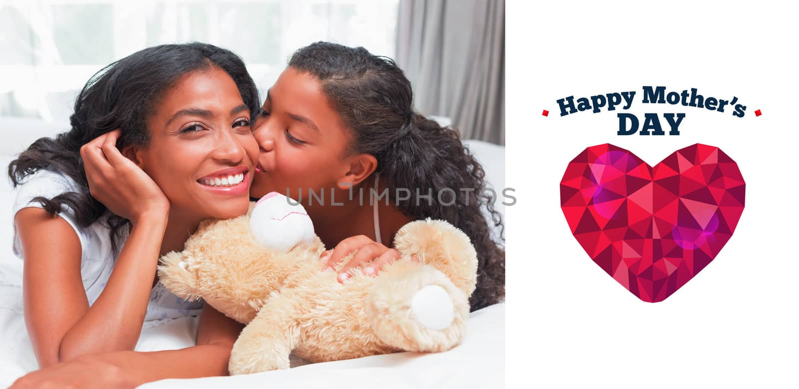 Pretty woman lying on bed with her daughter kissing cheek against happy mothers day