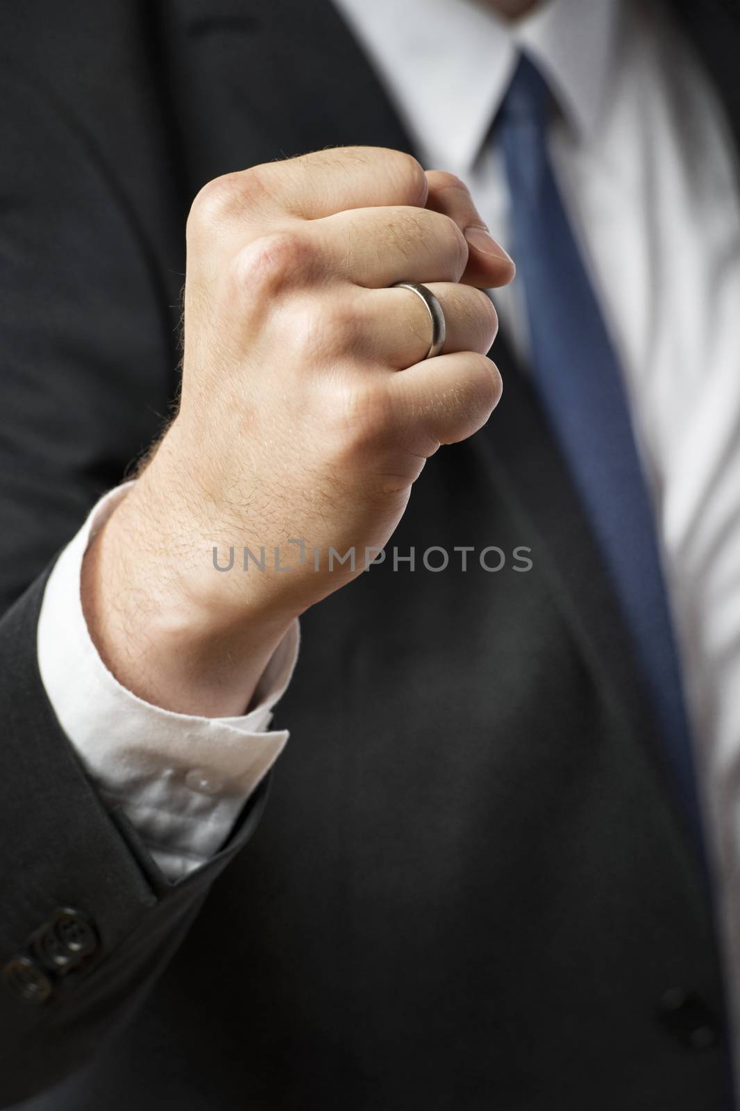 Closeup image of the fist of a businessman