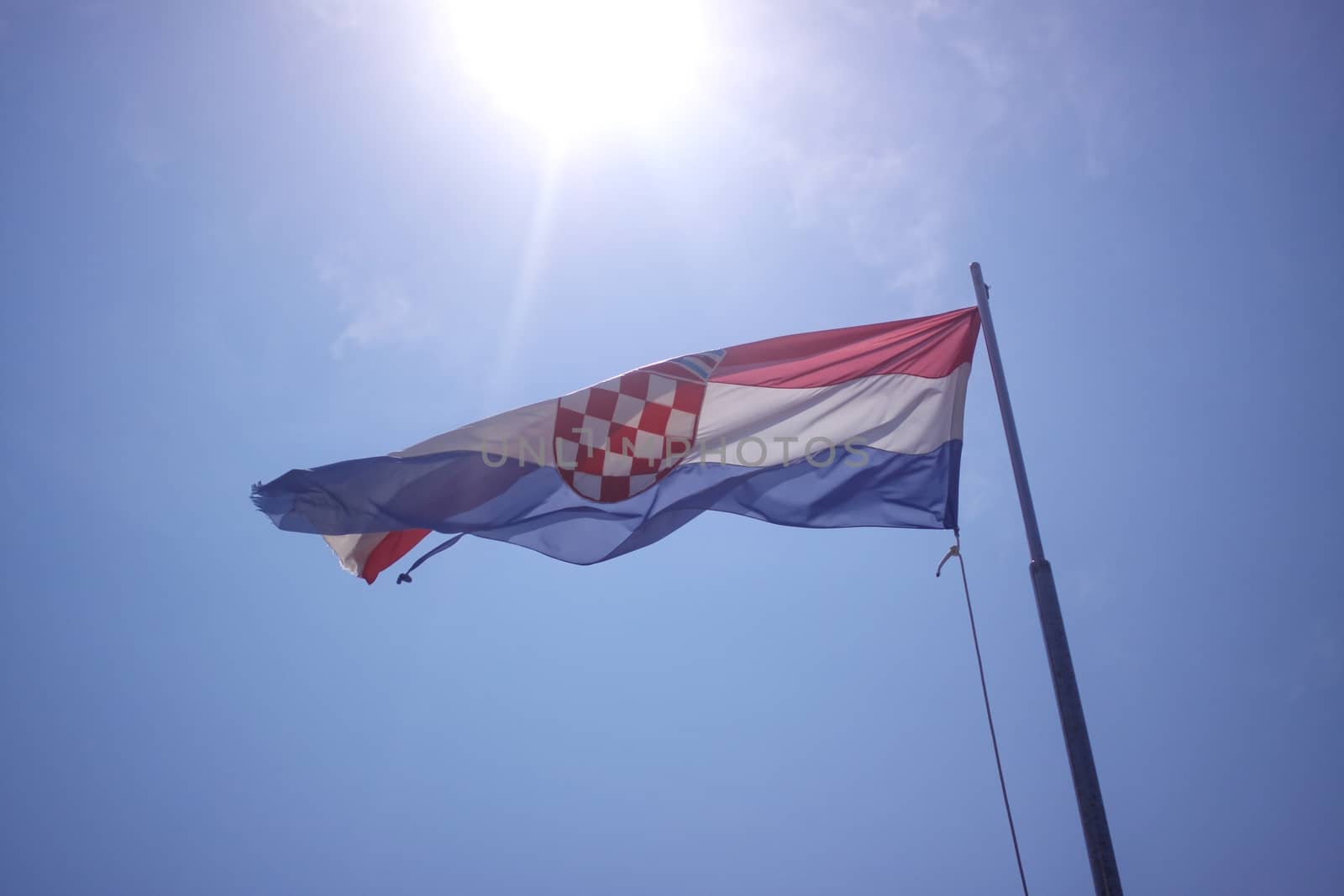 The flag of Croatia on blue sky  by Barbraford