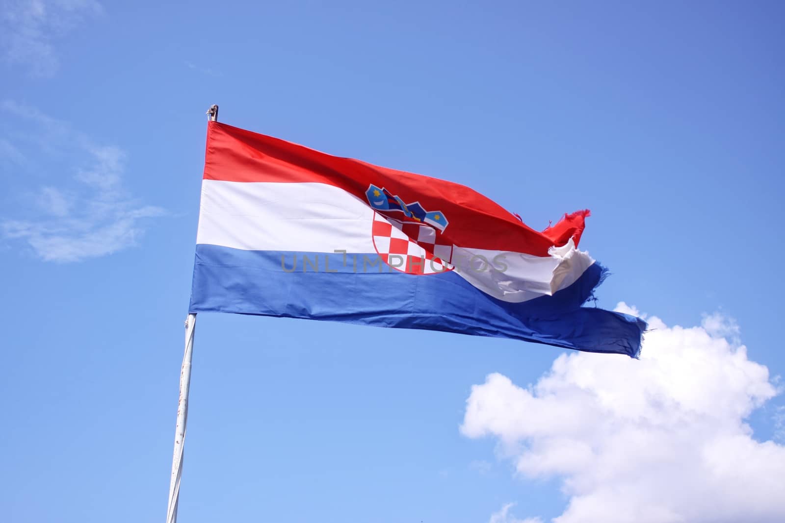 The flag of Croatia on blue sky , sunny day