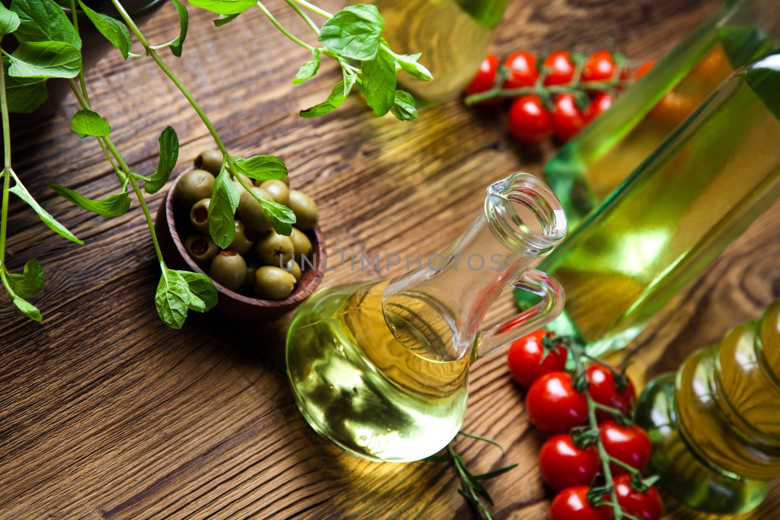 Olive oils in bottles, Mediterranean rural theme