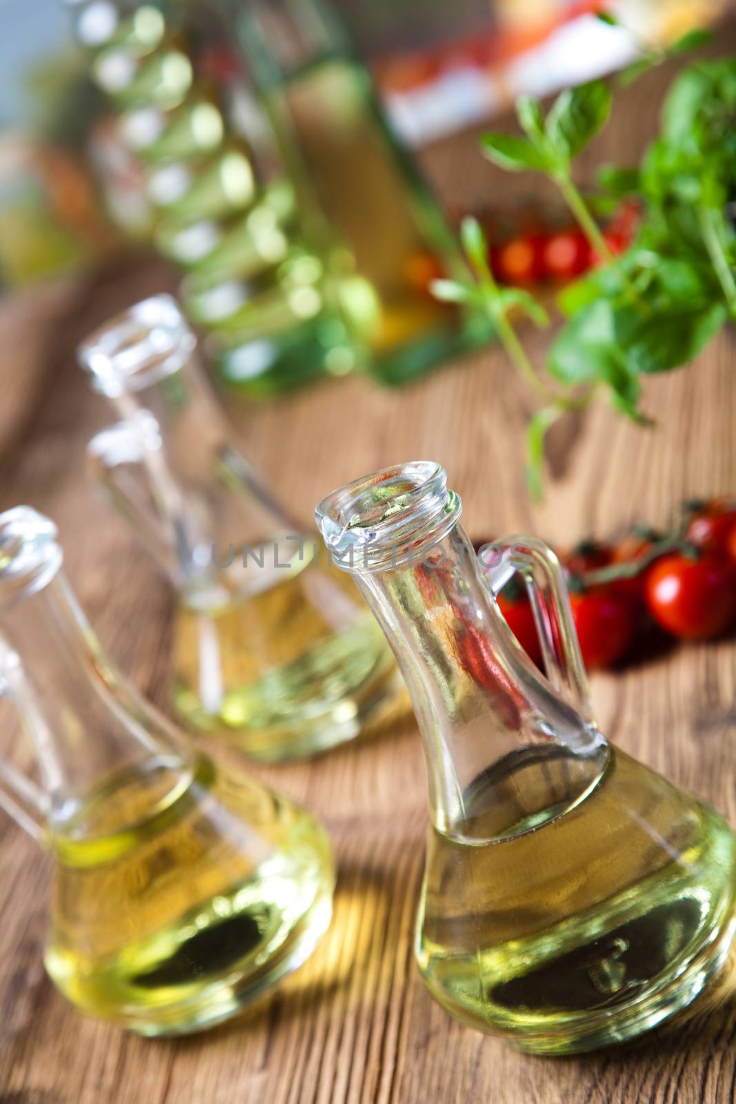 Olive oils in bottles, Mediterranean rural theme