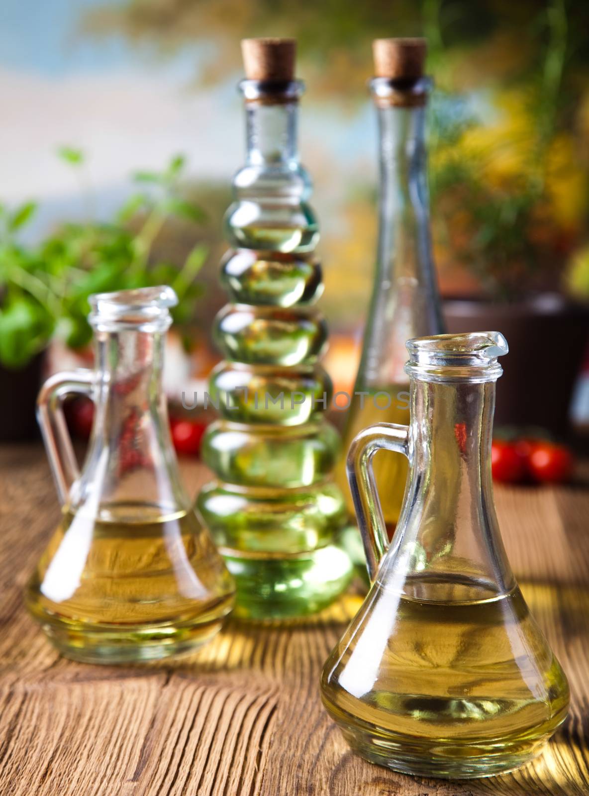 Olive oils in bottles, Mediterranean rural theme