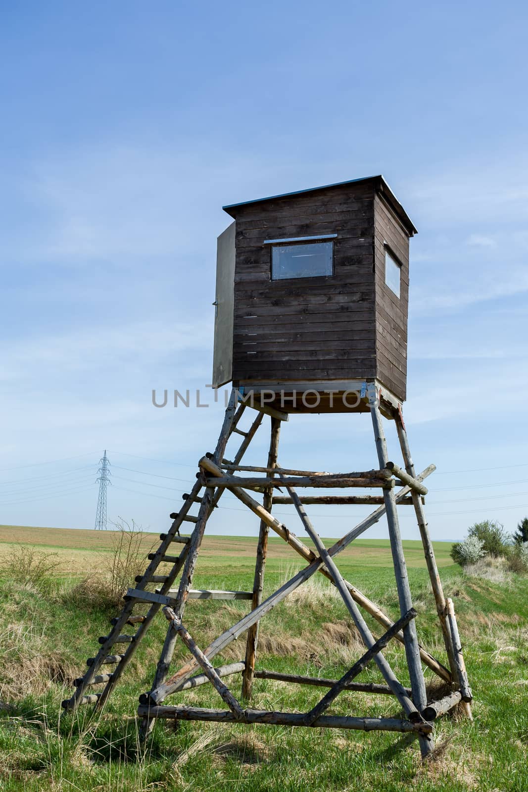 Wooden Hunters High Seat hunting tower in rural Landscape, Czech Republic Scenery 