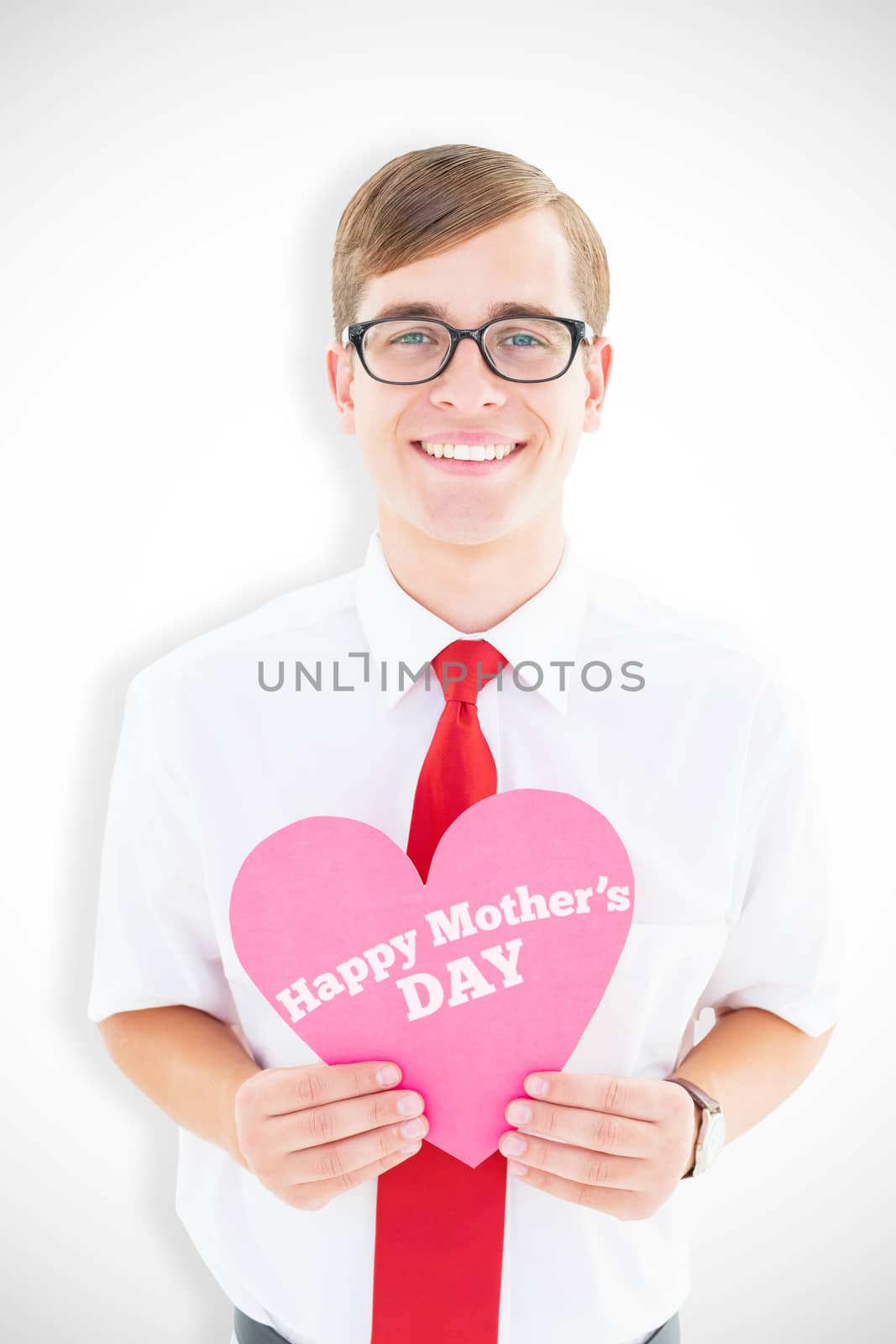 Geeky hipster holding heart card against mothers day greeting