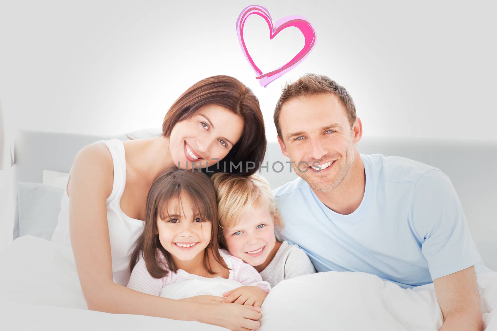 Portrait of a happy family sitting on the bed  against heart