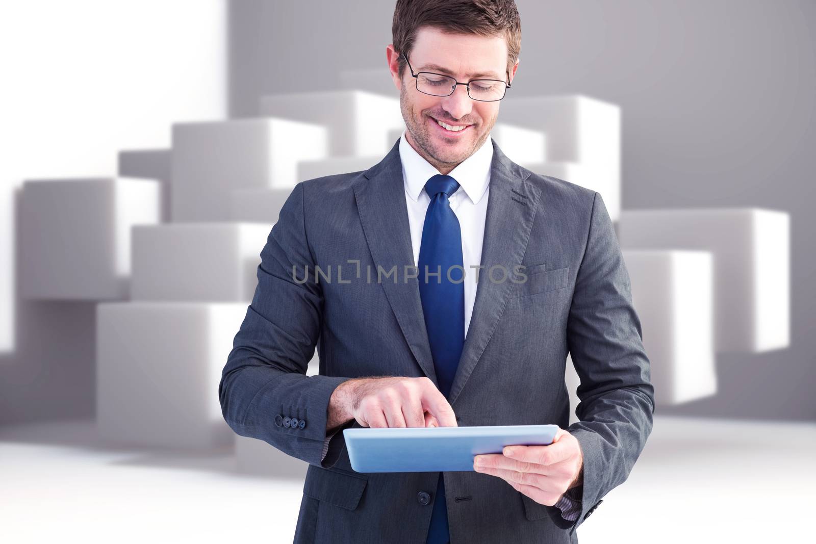 Composite image of businessman using his tablet pc  by Wavebreakmedia