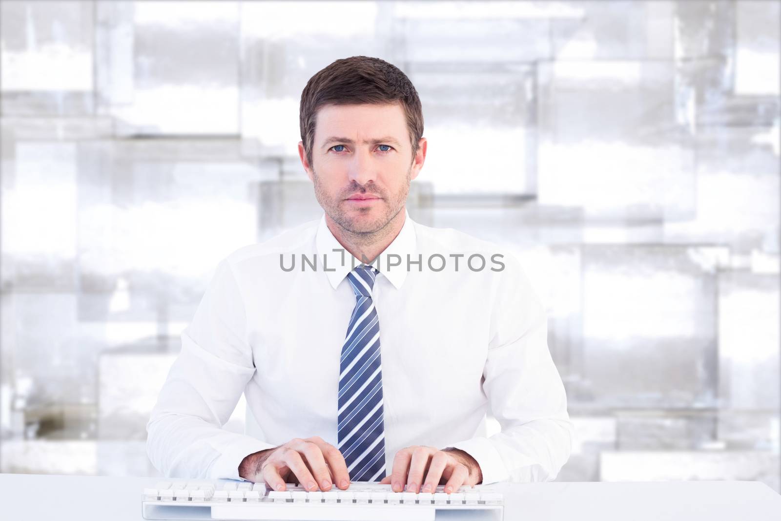 Composite image of businessman working at his desk by Wavebreakmedia
