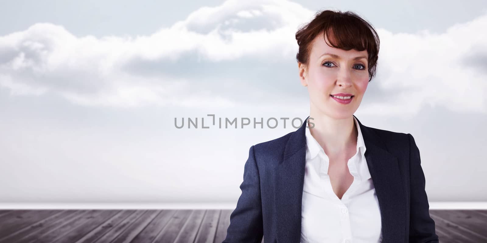 Smiling businesswoman against clouds in a room