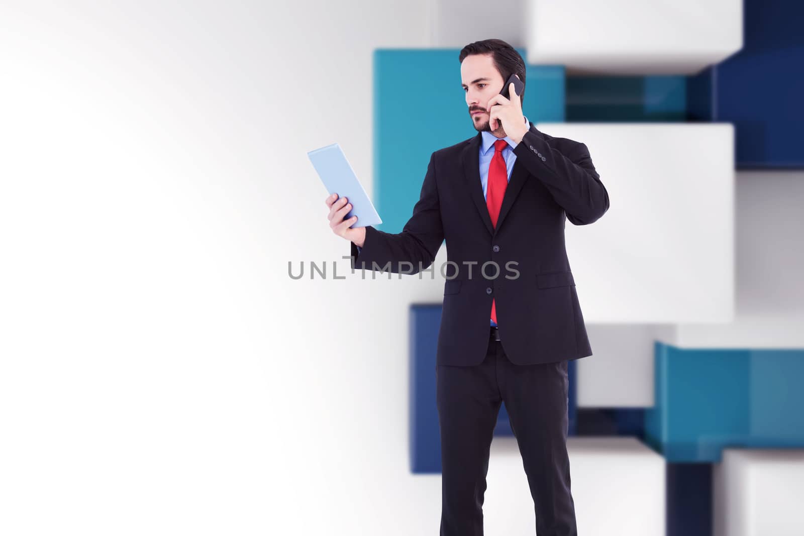 Businessman talking on phone holding tablet pc against abstract background