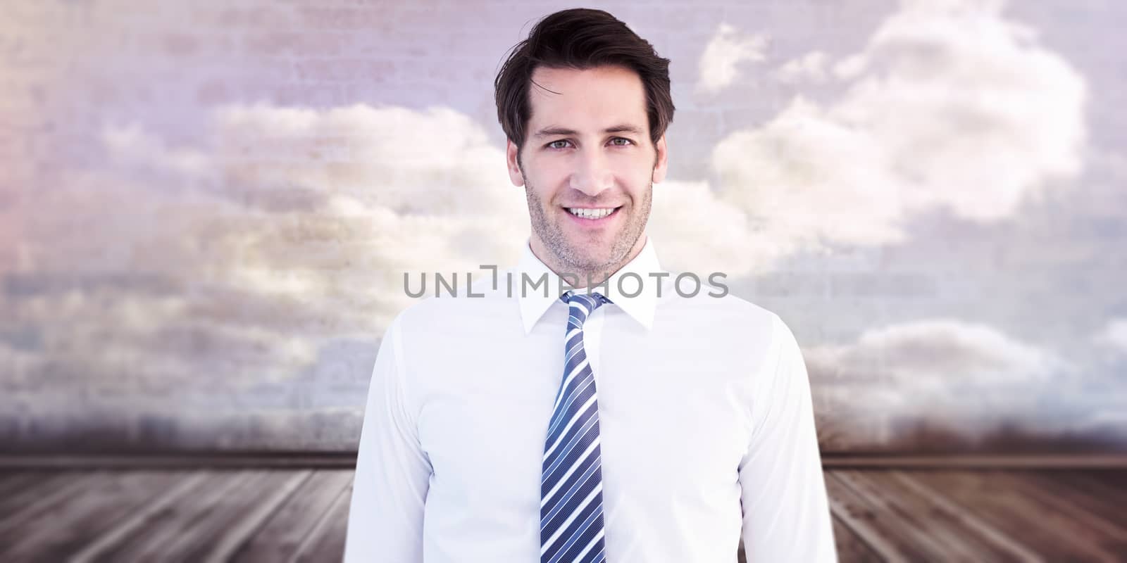 Smiling businessman standing with hands in pockets against clouds in a room
