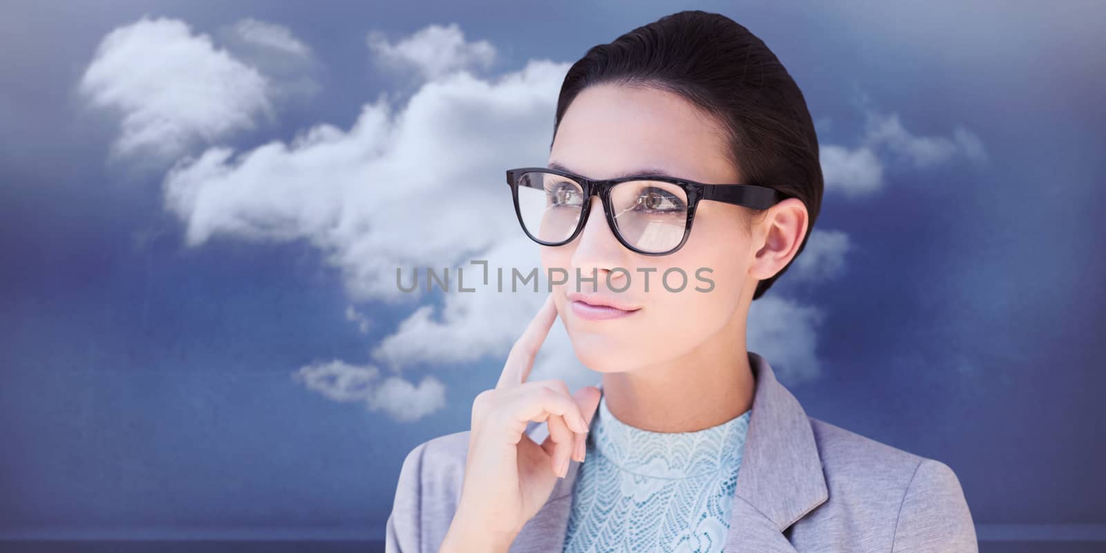 Happy brunette against clouds in a room