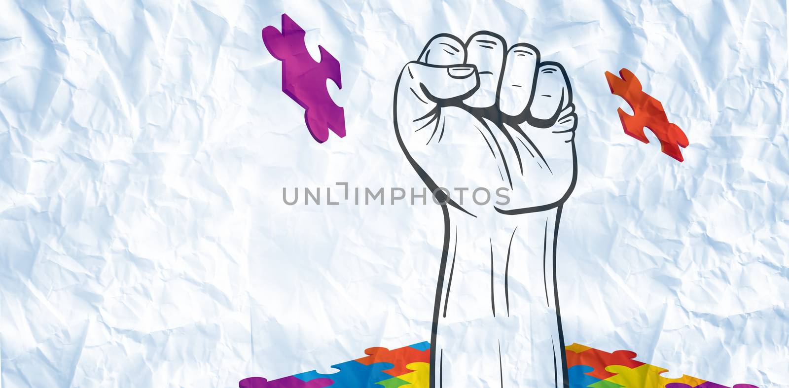Hand punching through jigsaw against crumpled white page 