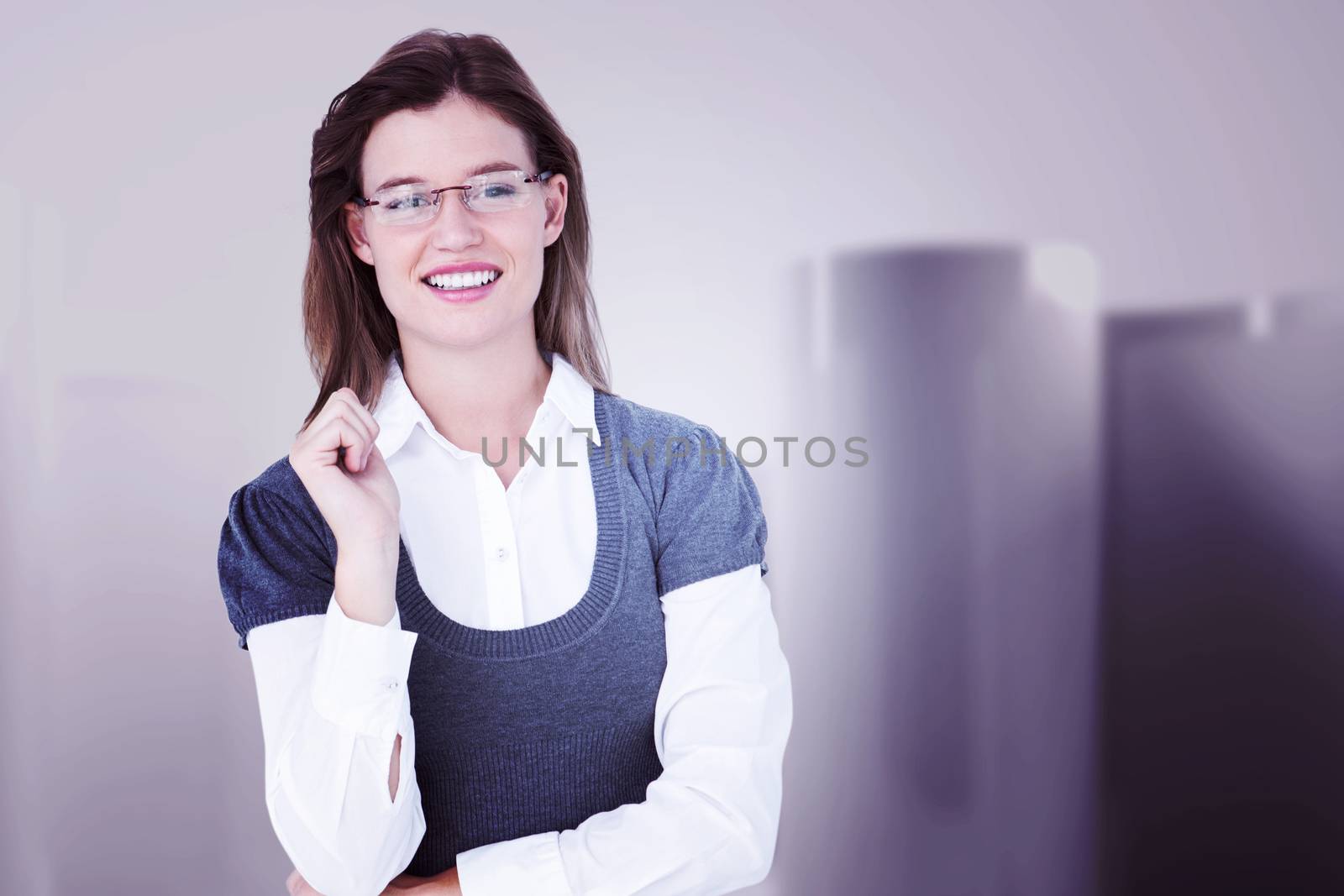 Smiling woman looking at camera  against abstract white room