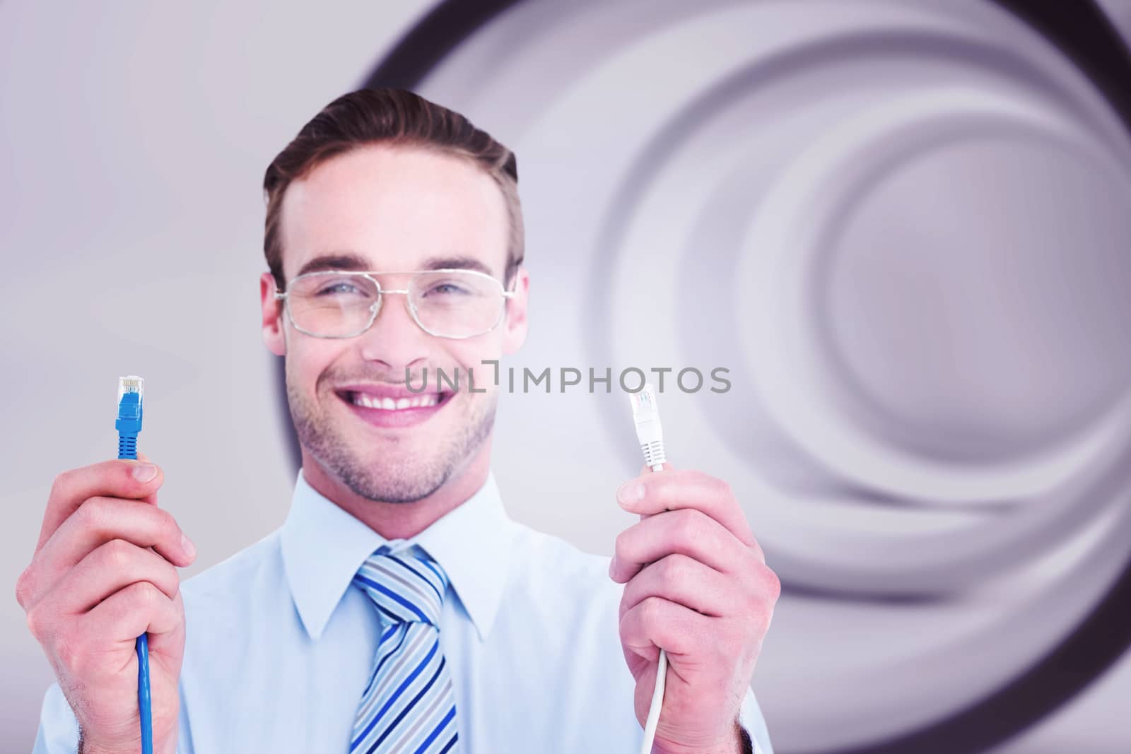 Composite image of geeky businessman holding two cables by Wavebreakmedia