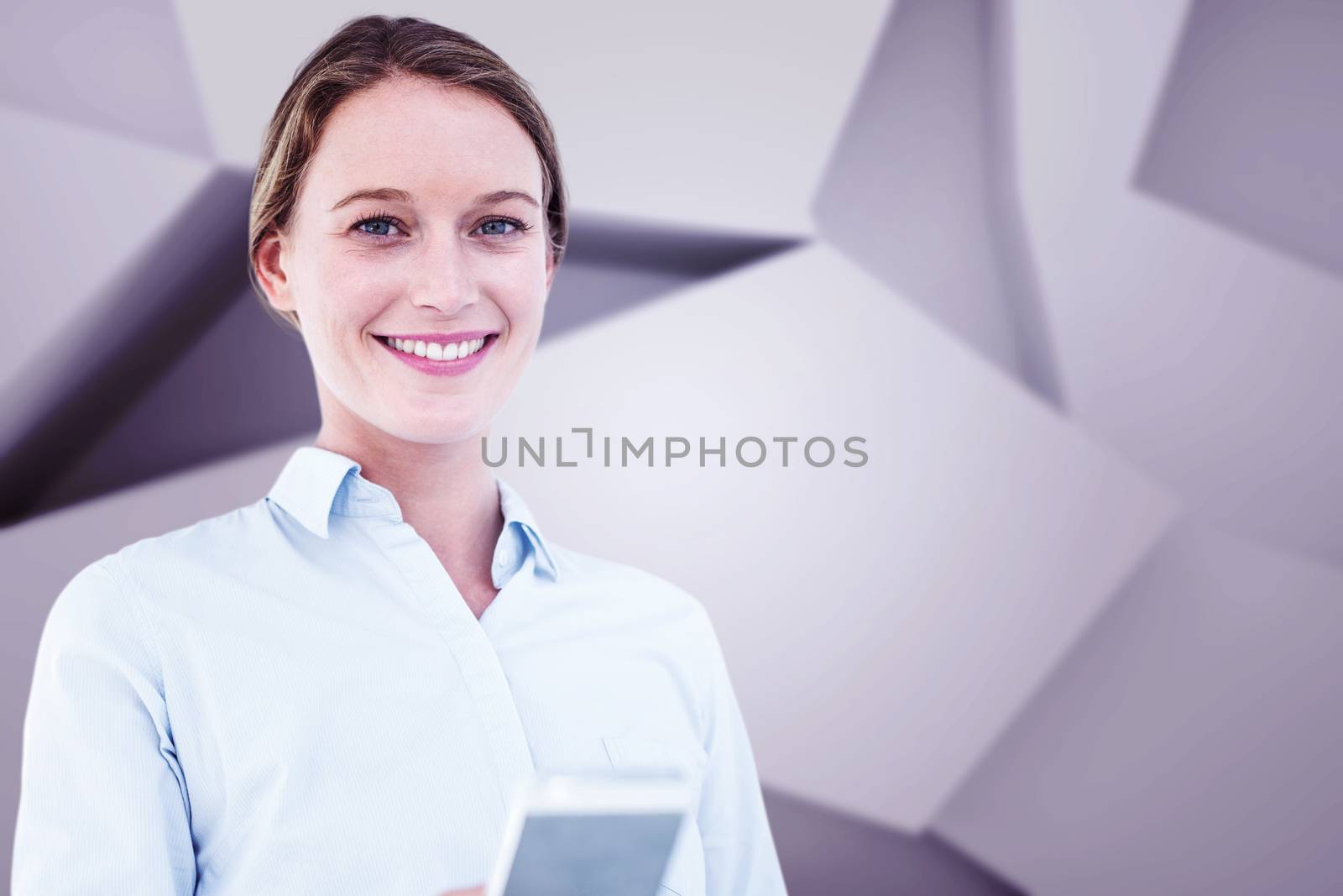 Businesswoman using her mobile phone against abstract grey room