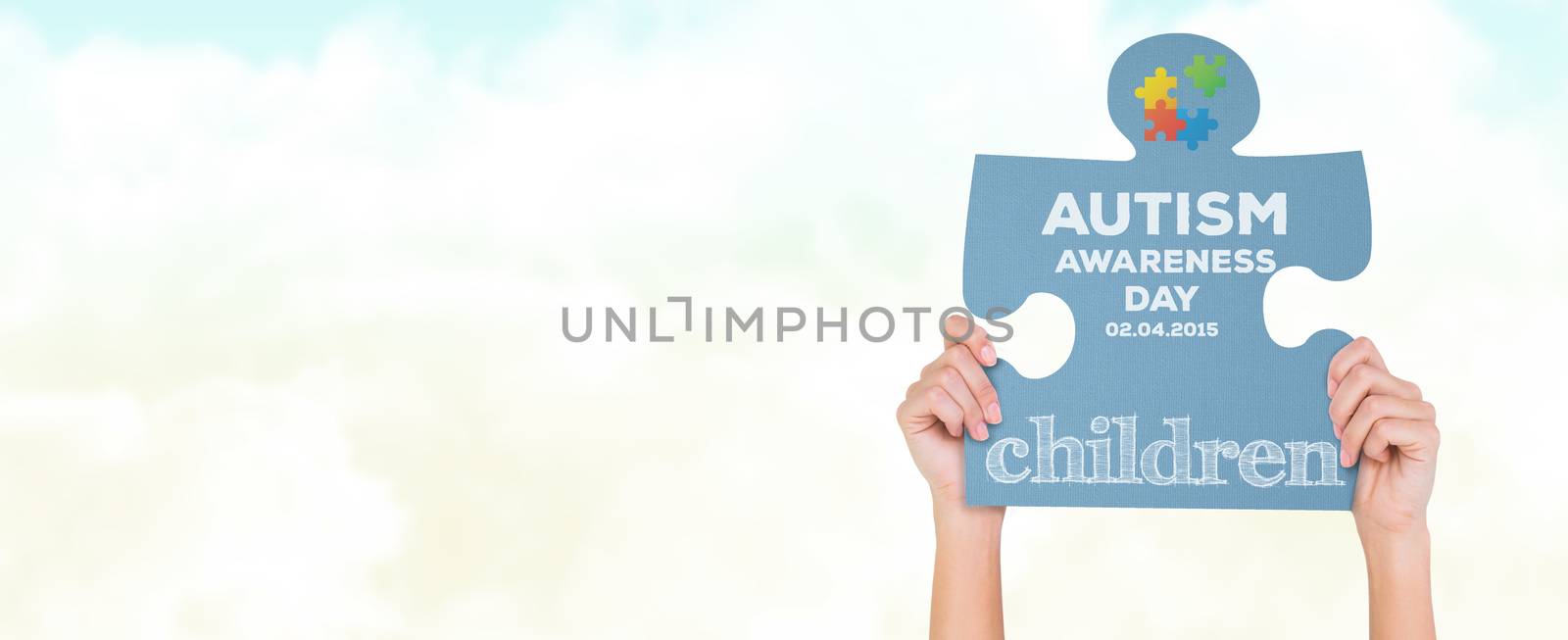 Hands showing jigsaw puzzle against blue sky