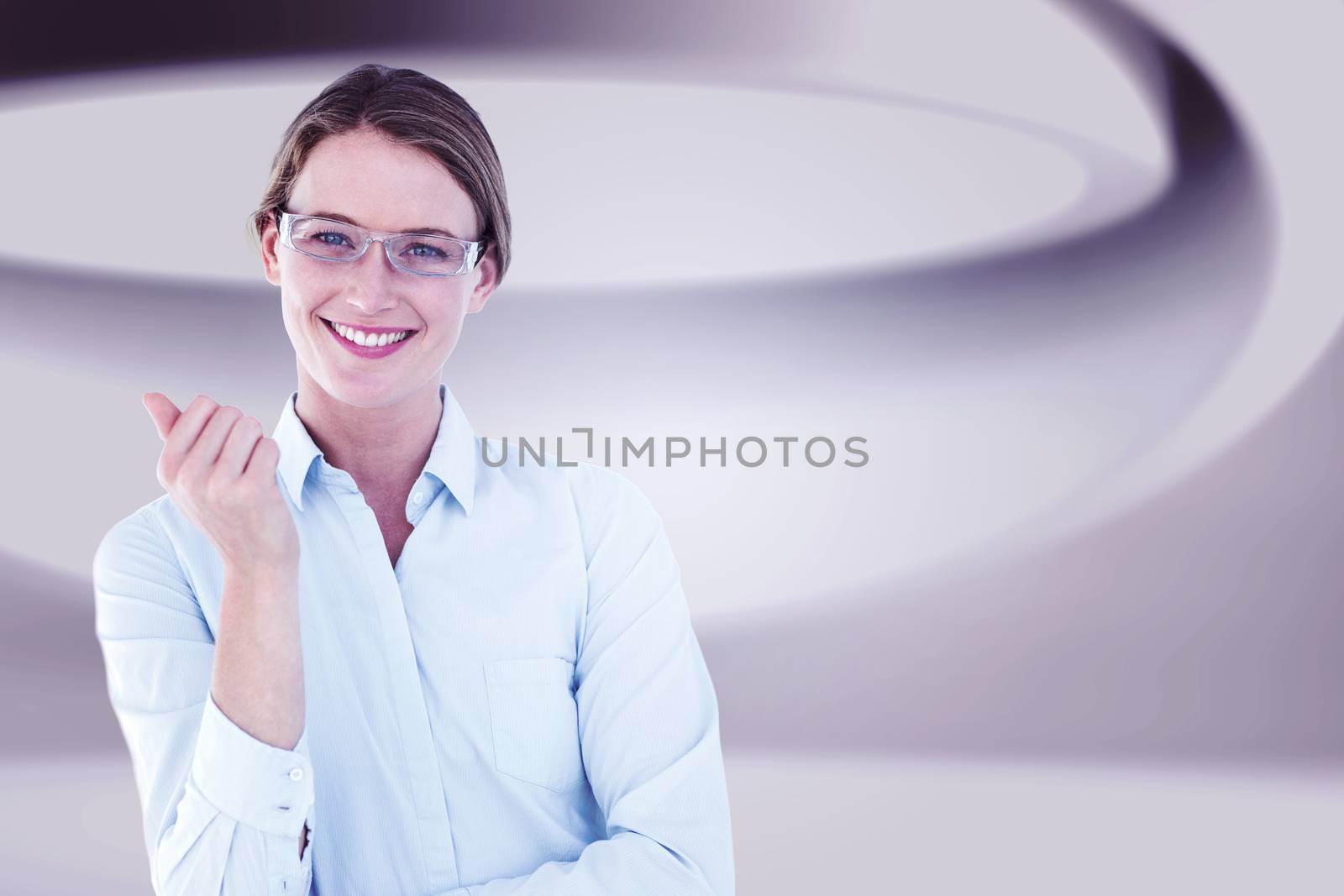 Smiling businesswoman looking at camera against white abstract room