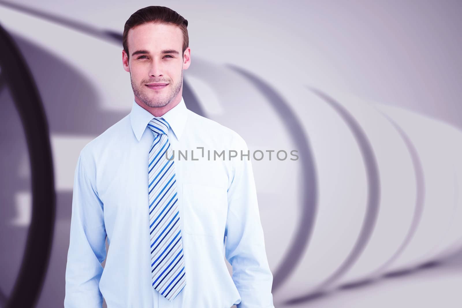 Cheerful businessman posing with hands in pockets against white abstract room