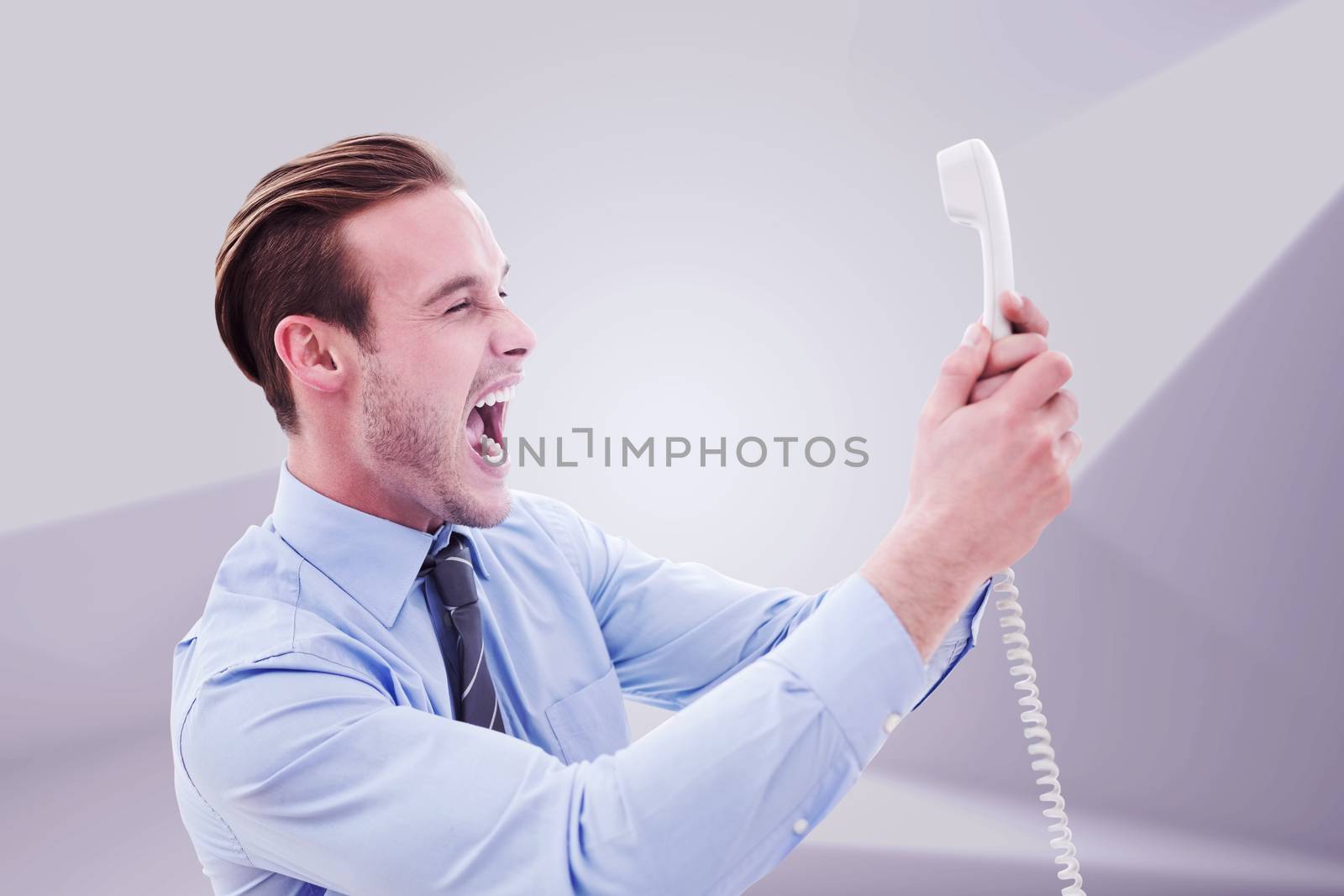 Businessman shouting at phone against abstract white room