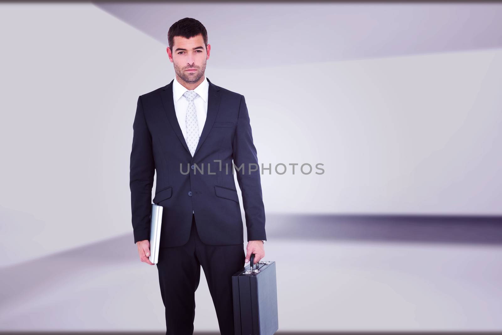 Composite image of businessman standing with his briefcase and documents by Wavebreakmedia