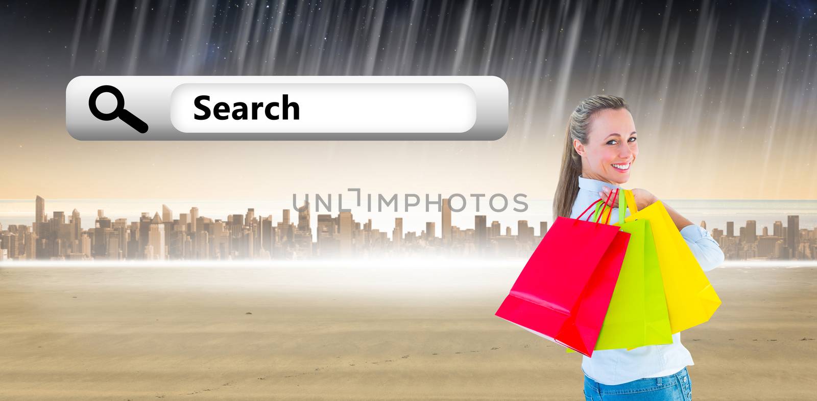 Smiling blonde holding shopping bags against city on the horizon