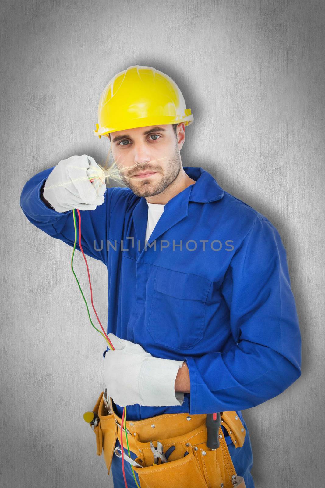 Composite image of confident repairman holding cables by Wavebreakmedia
