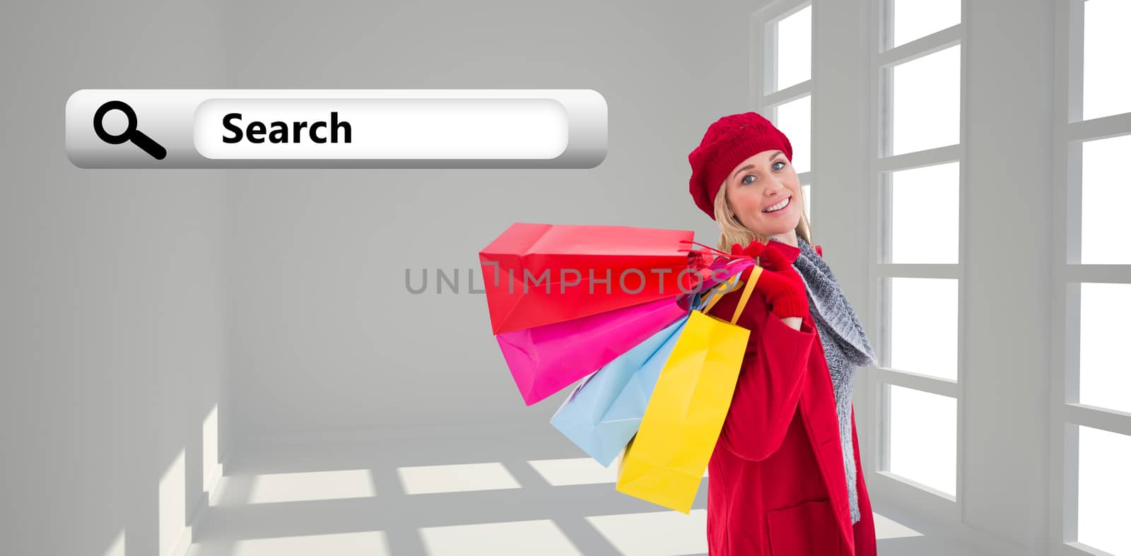 Blonde in winter clothes holding shopping bags against white room with windows