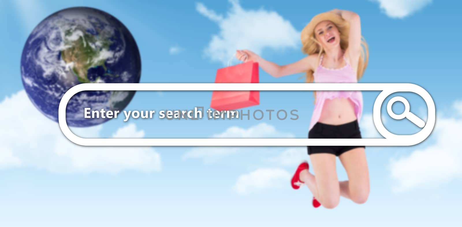 Pretty young blonde holding shopping bags against blue sky