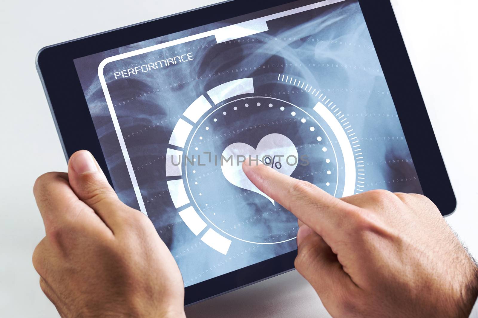 Man using tablet pc against medical interface on xray