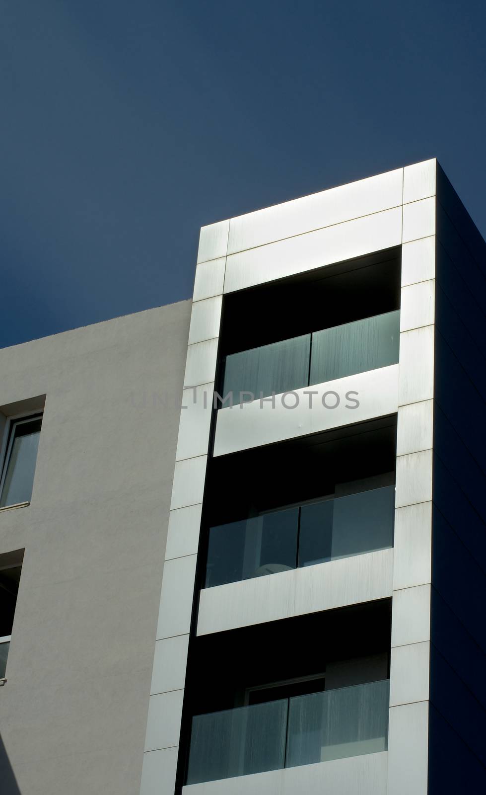 Part of Modern Building with Exterior Elements of Stainless Steel on Blue Sky background Outdoors