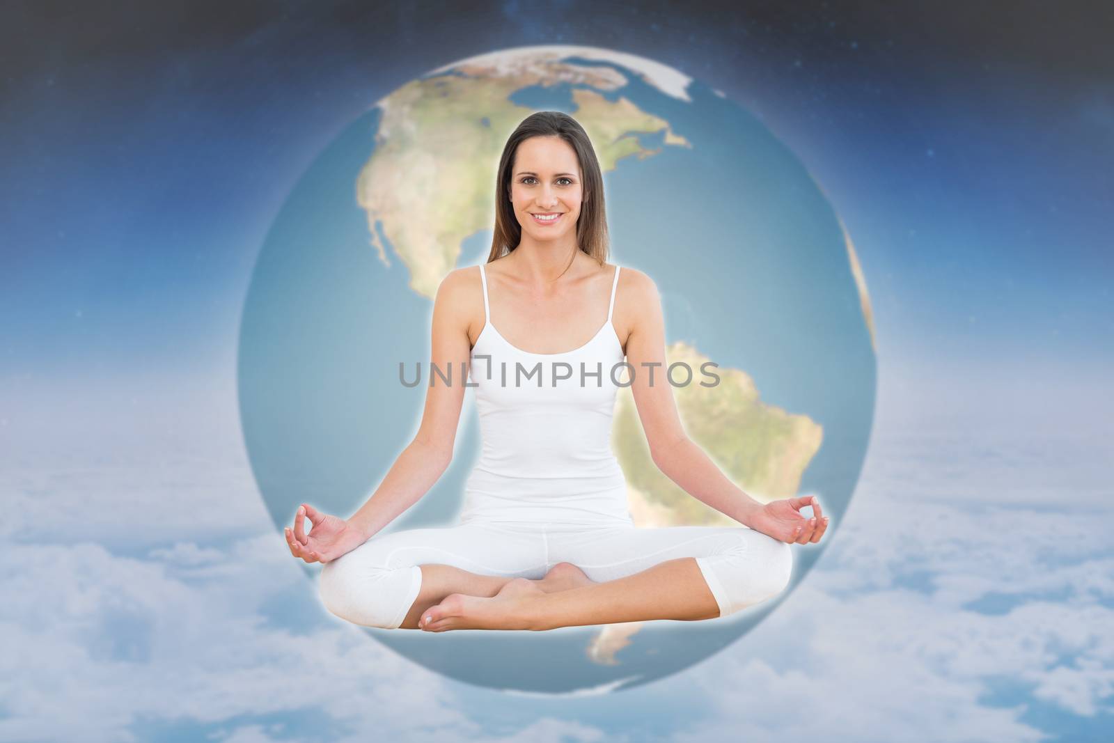 Composite image of toned woman in lotus pose at fitness studio by Wavebreakmedia