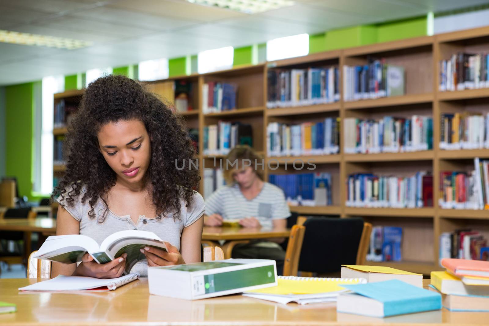 Student studying in the library at the university