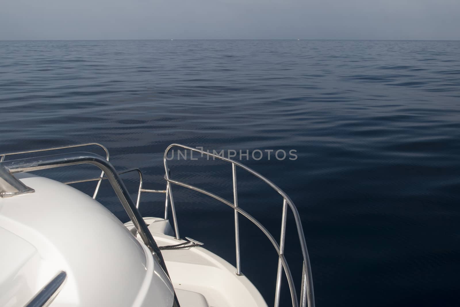 calm sea with yacht on foreground