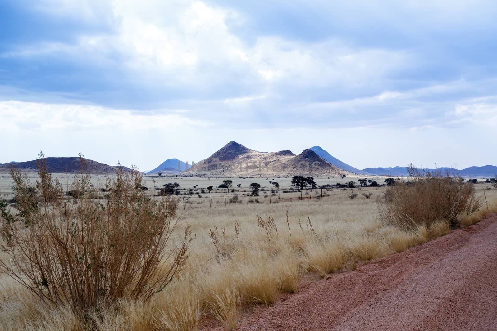endless road in fantrastic Namibia moonscape landscape, Hardap region